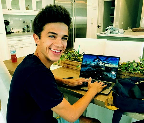 brent rivera using laptop