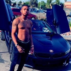 Image of Singer, Darryl Granberry with his BMW i8 car